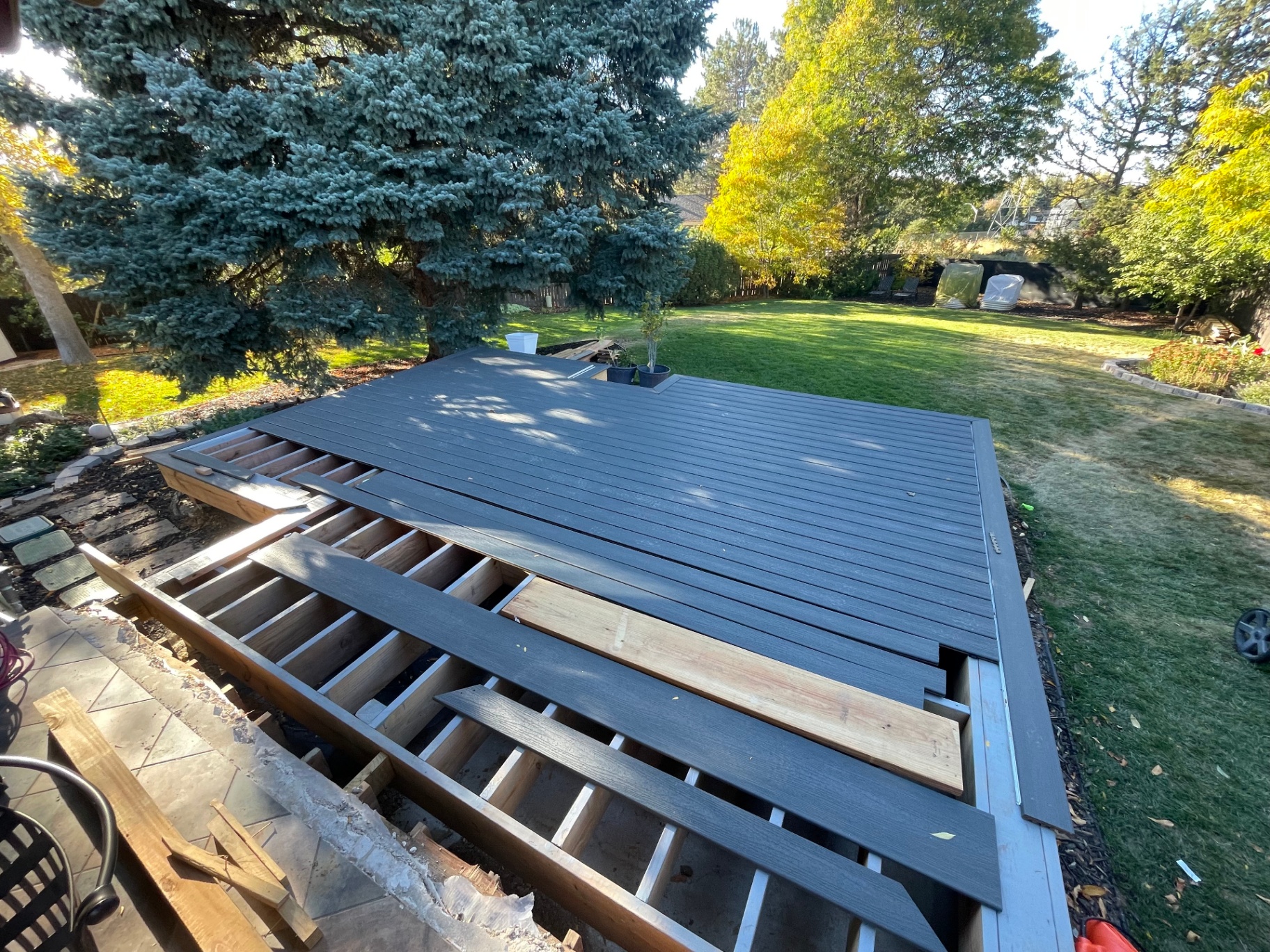 Deck framing and composite decking installation in progress