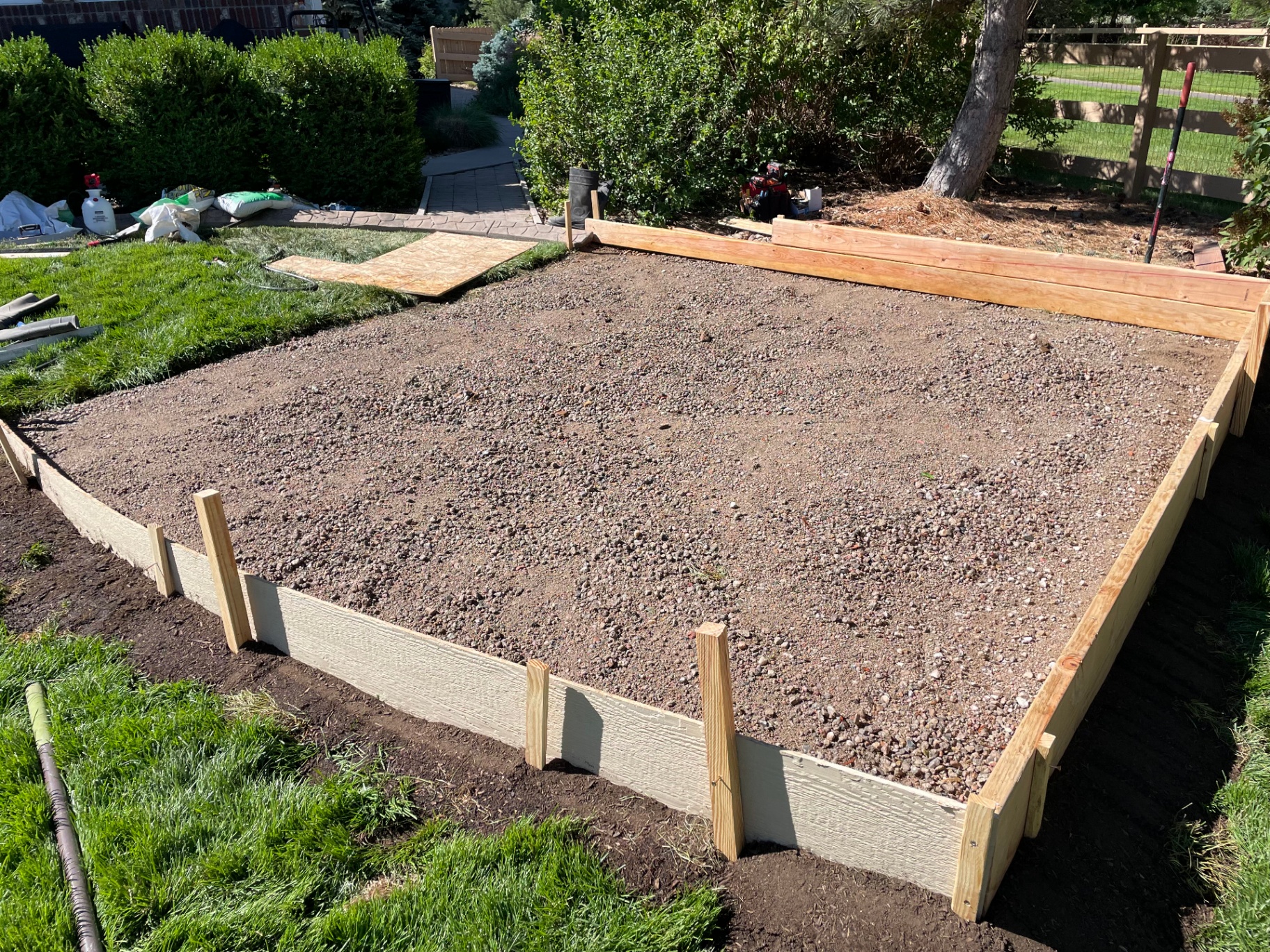 Concrete pad formed and compacted before pergola installation