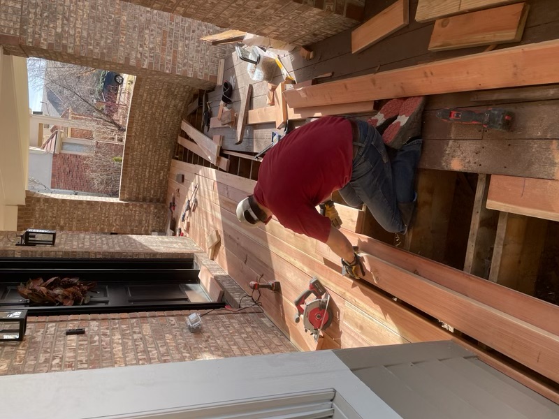 Cedar porch deck boards being installed