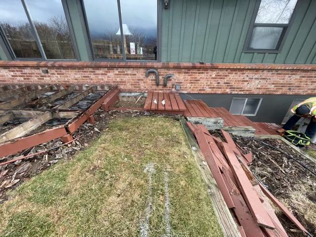 Old deck demolition before retaining wall and concrete build