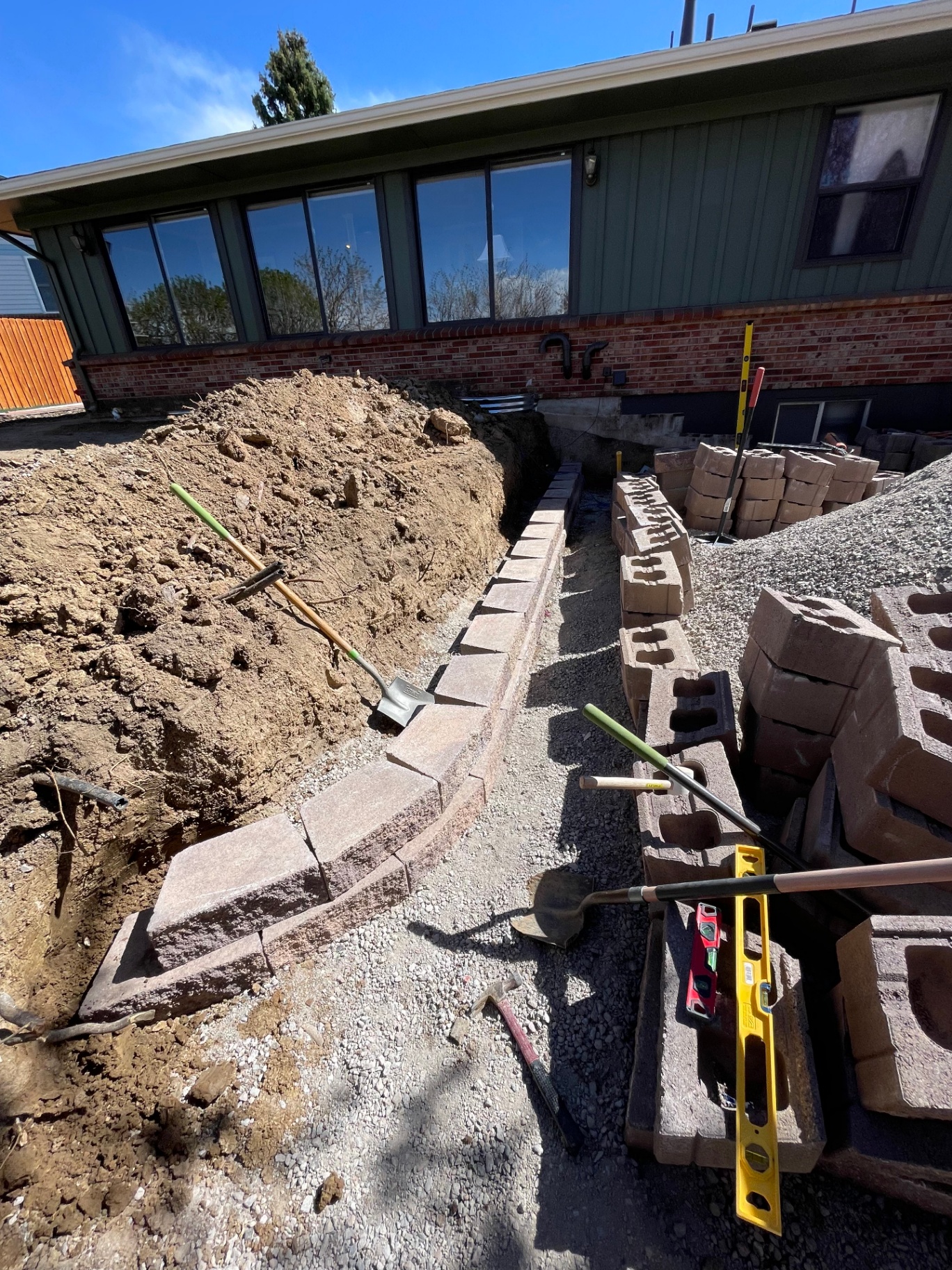 Segmental retaining wall construction in progress